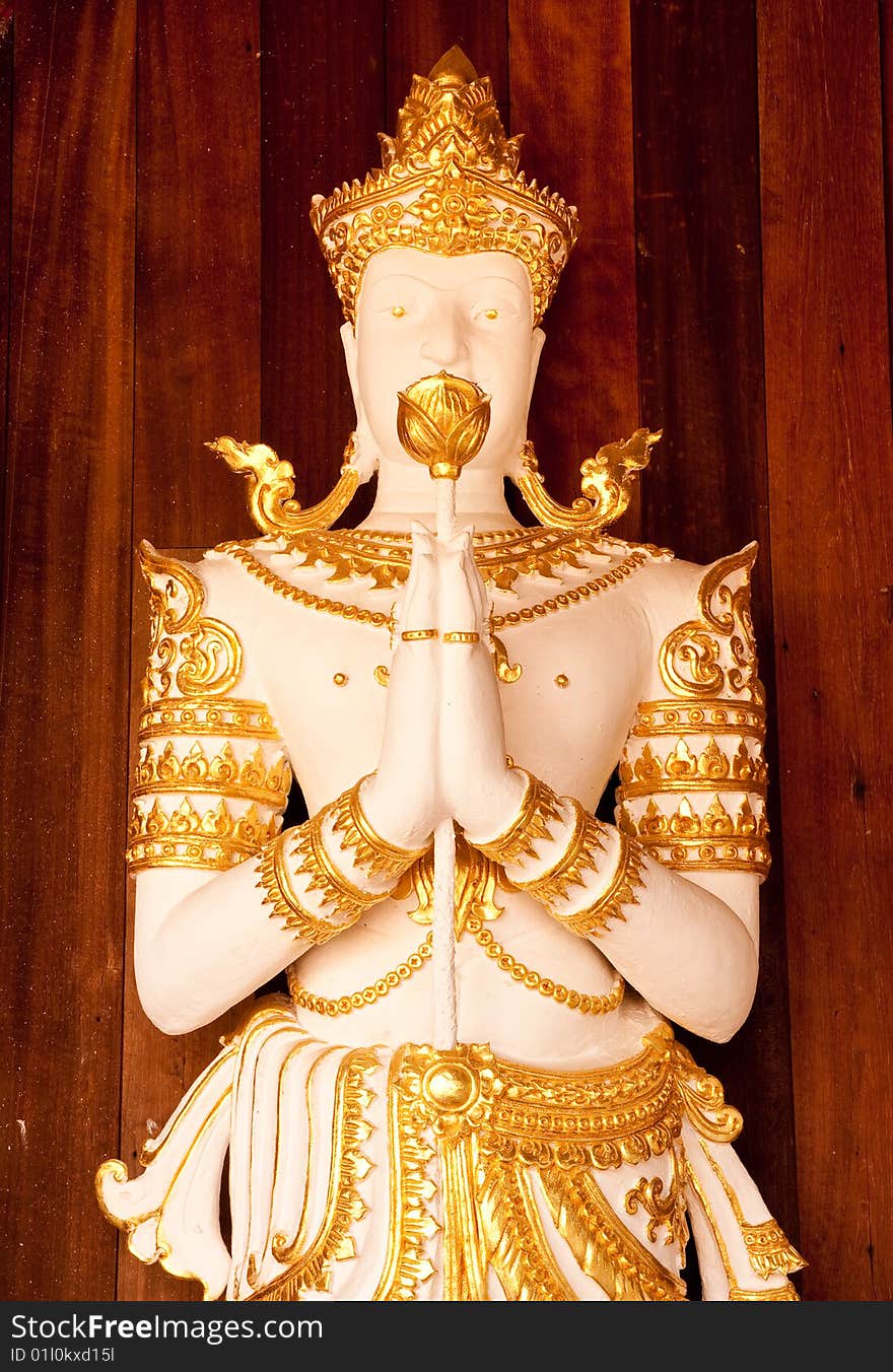 Deva statue in traditional Thai style of Wat Ming Maung, Chaing Rai province, north of Thailand. Deva statue in traditional Thai style of Wat Ming Maung, Chaing Rai province, north of Thailand