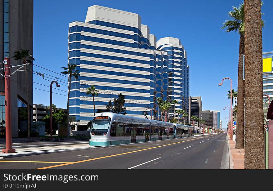 Street with sky scrapers, and light rail. Street with sky scrapers, and light rail.