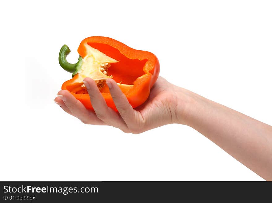 Cut bulgarian pepper on palm insulated on white background