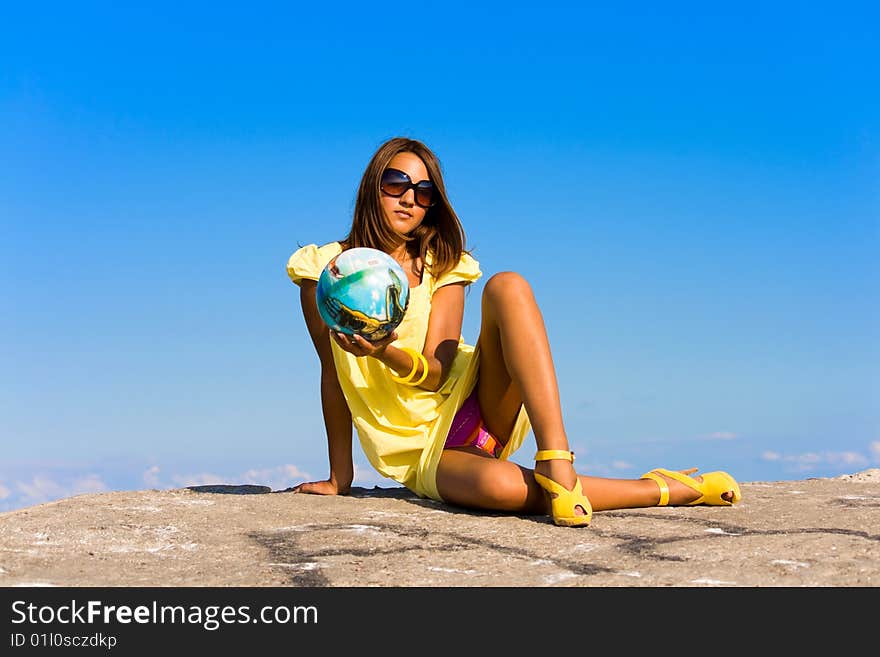 Swarthy young girl poses on the beach