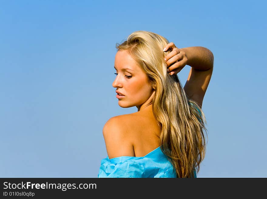 Gorgeous blond woman posing in a beach. Gorgeous blond woman posing in a beach