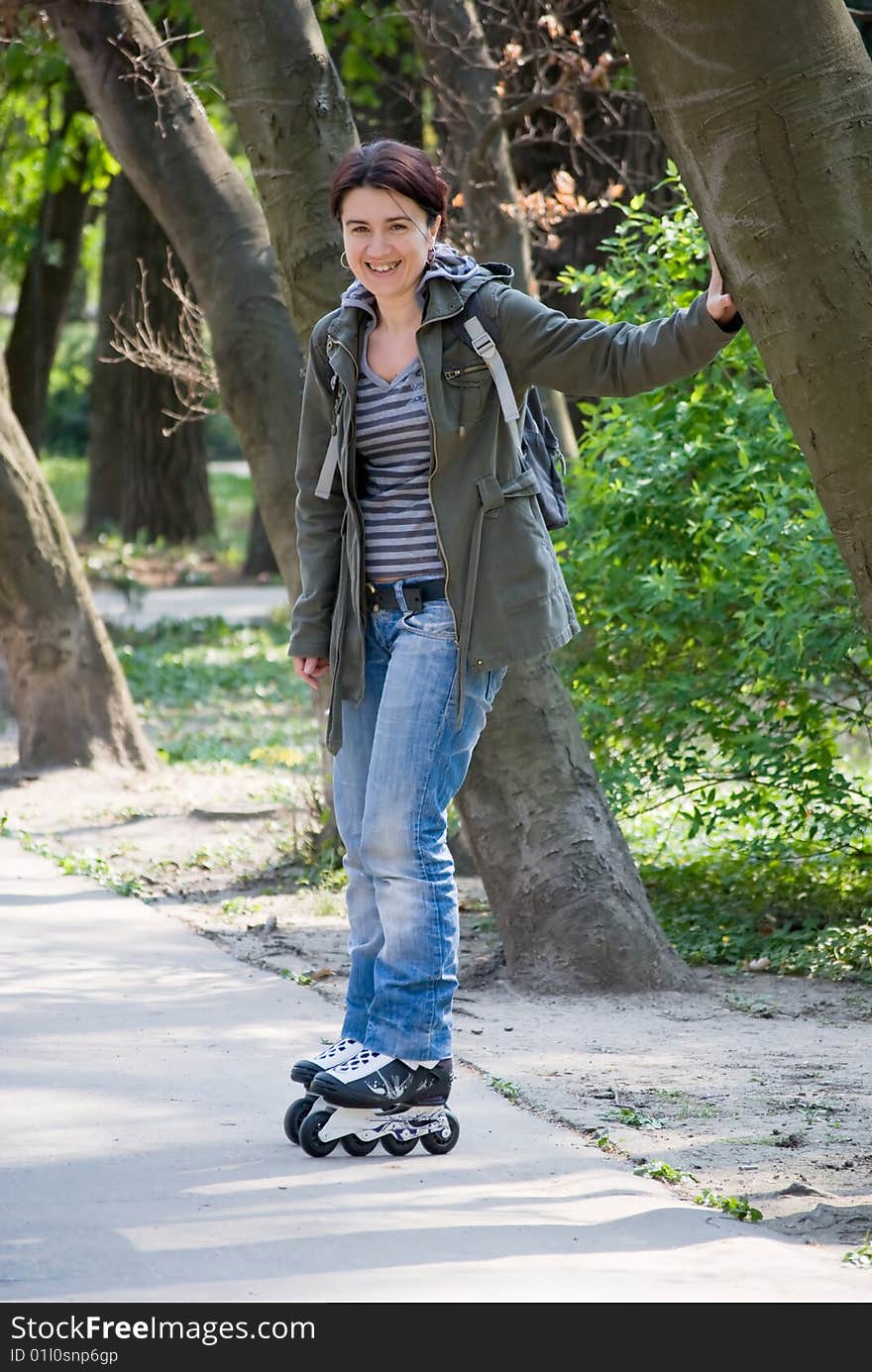 Rollerblade girl having fun in the park