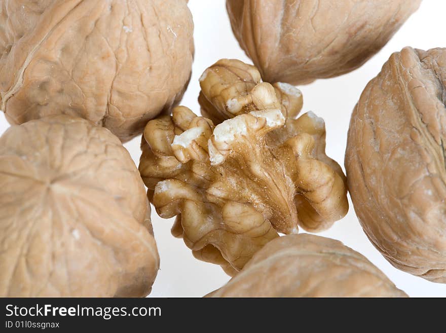 Crushed walnut on white background