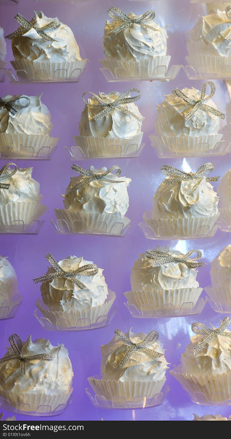 Arranged white candy, purple background