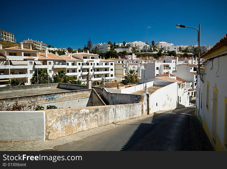 Houses and road in Portuguise town. Houses and road in Portuguise town