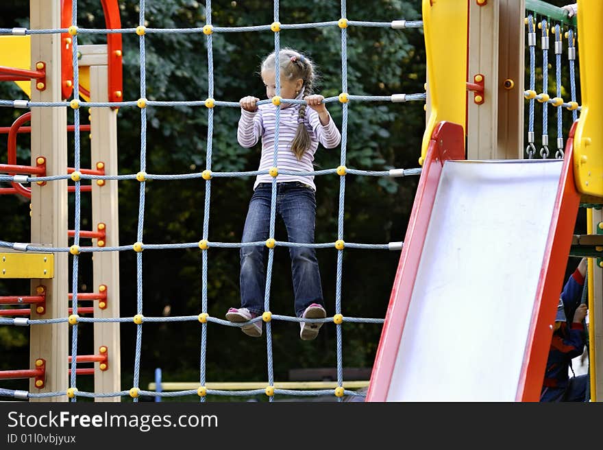 Girl plays on baby platform