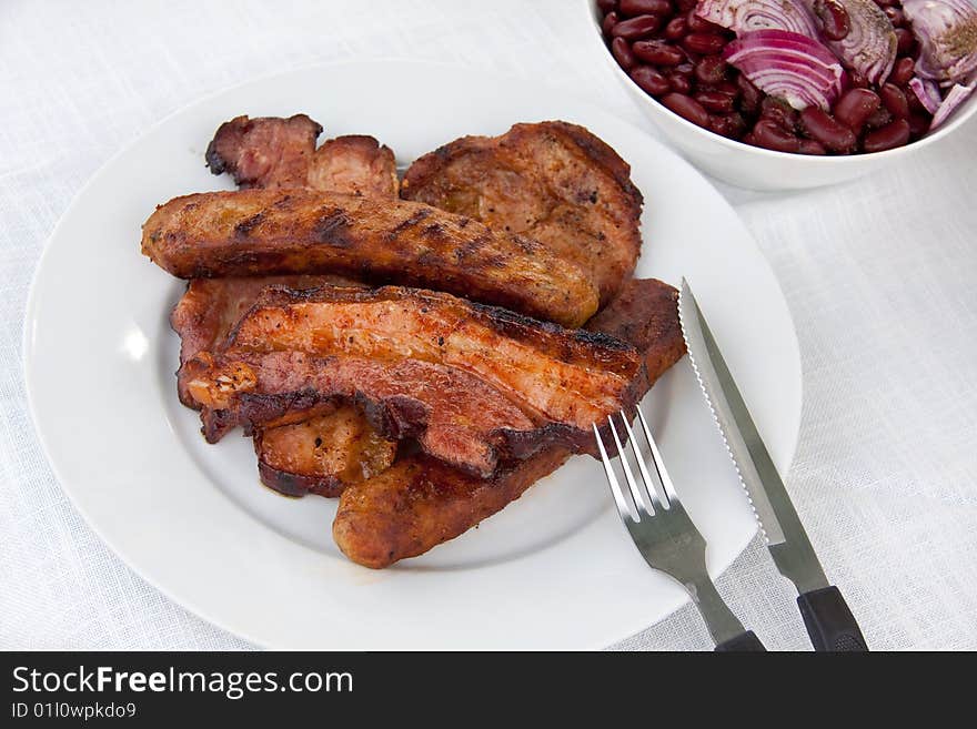 Fried lunch with roasted bacon,sausage,cutlet