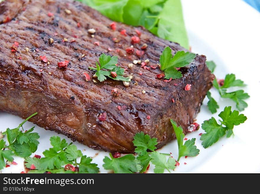 Roast Big Steak  On Green Dish Close Up