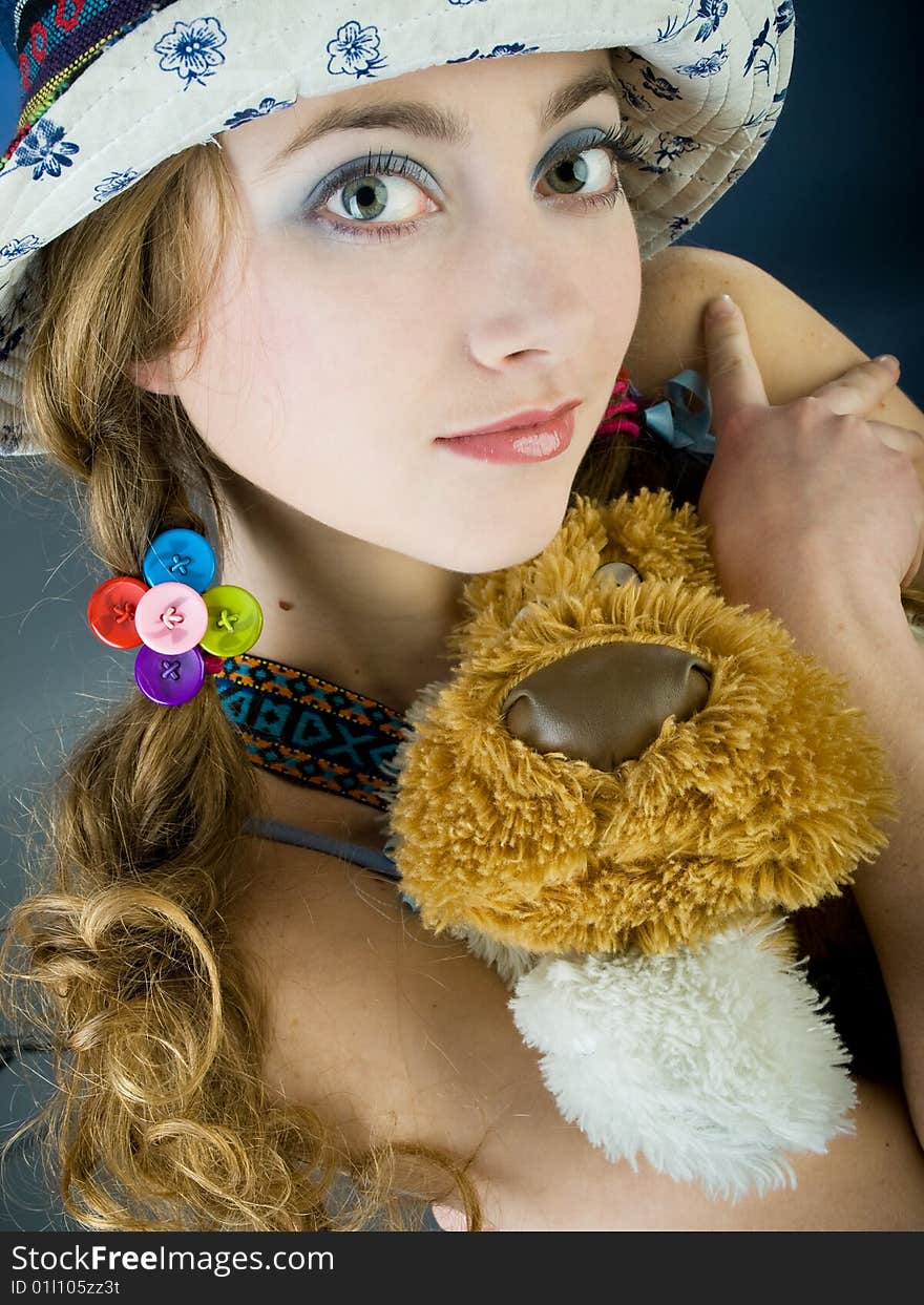 Funny blue-eyed girl with plush toy. Funny blue-eyed girl with plush toy