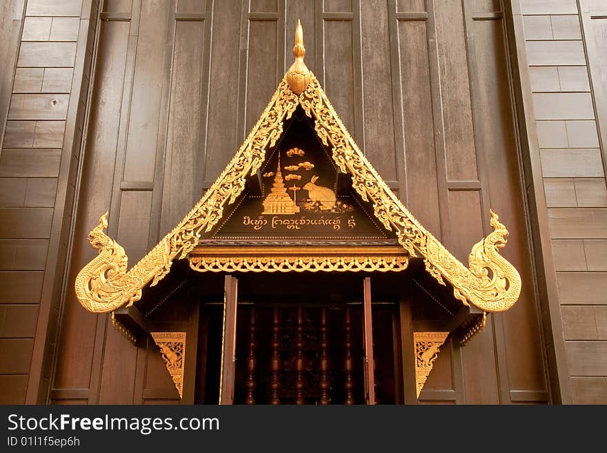 Decoration of window in traditional Thai style, Wat Phra Kaew, Chiang Rai province, Thailand.