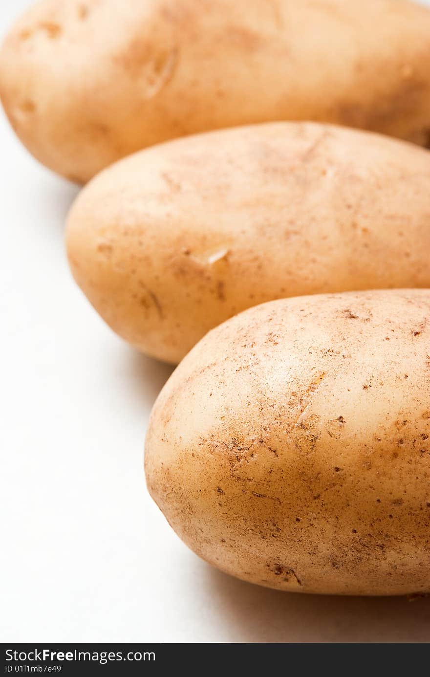 Raw brown potato isolated on white background. Raw brown potato isolated on white background