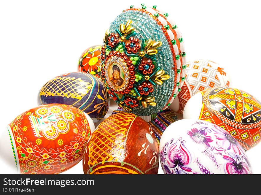 An easter eggs is decorated a bead on a white background