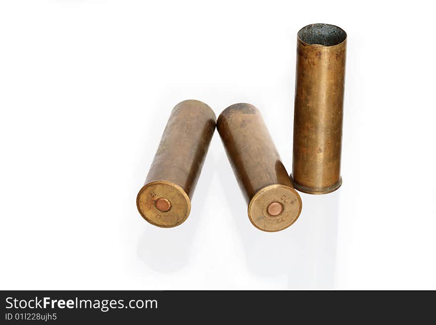 Three old brass cartridges for fowling piece isolated on white background. Three old brass cartridges for fowling piece isolated on white background