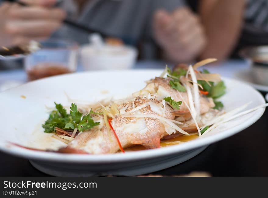 Delicious Chinese seafood dish in white plate. Delicious Chinese seafood dish in white plate