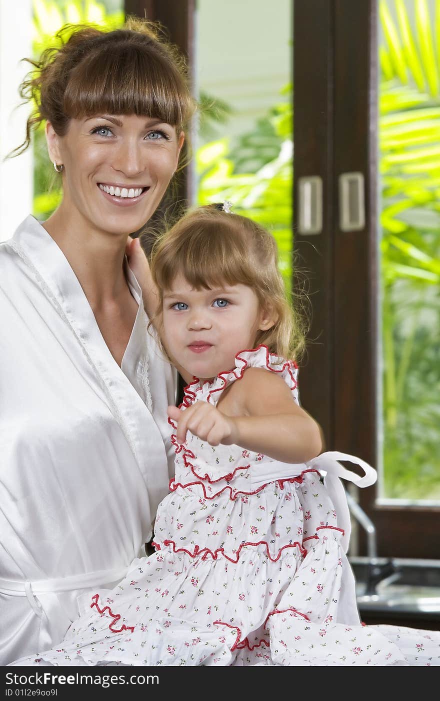 Portrait of beautiful young woman with her daughter. Portrait of beautiful young woman with her daughter