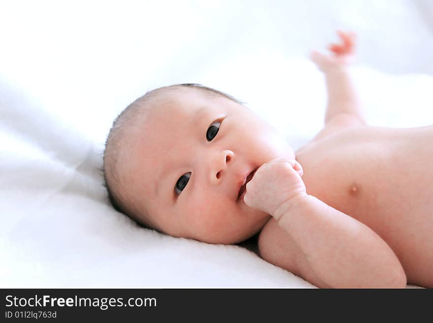 Closeup of adorable baby on a white background