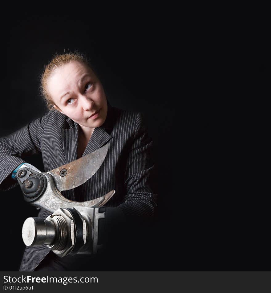 Female with gun instead of hands against the black background. Female with gun instead of hands against the black background