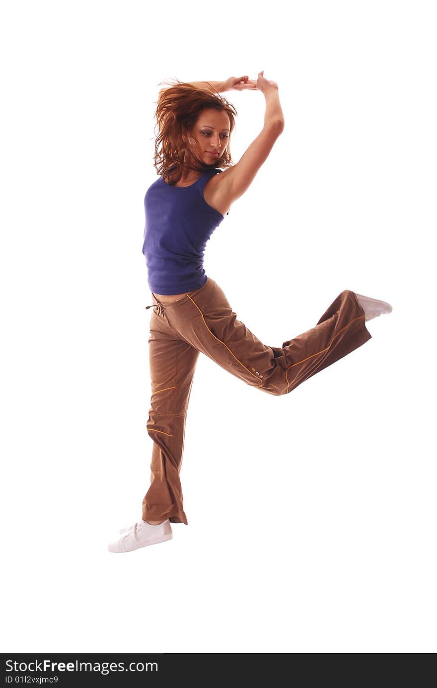 Attractive teenage dancing over white background