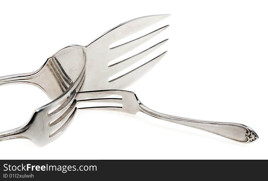 Silver forks set setout on a white background. With clipping path.