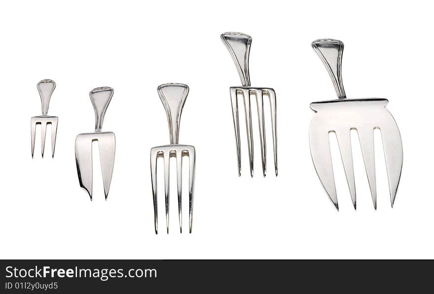 Silver forks set setout on a white background. With clipping path.