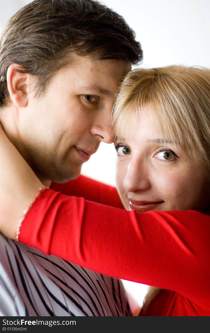 Happy young couple is happy. The girl and the young man are smiling. Happy young couple is happy. The girl and the young man are smiling.