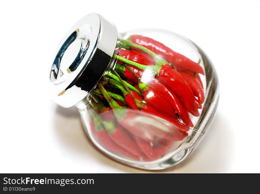 Close up capture red spicy chili on white background. Close up capture red spicy chili on white background