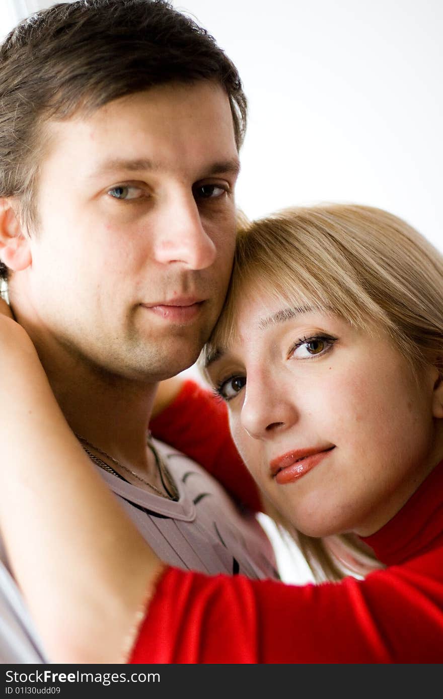 Happy young couple is happy. The girl and the young man are smiling. Happy young couple is happy. The girl and the young man are smiling.