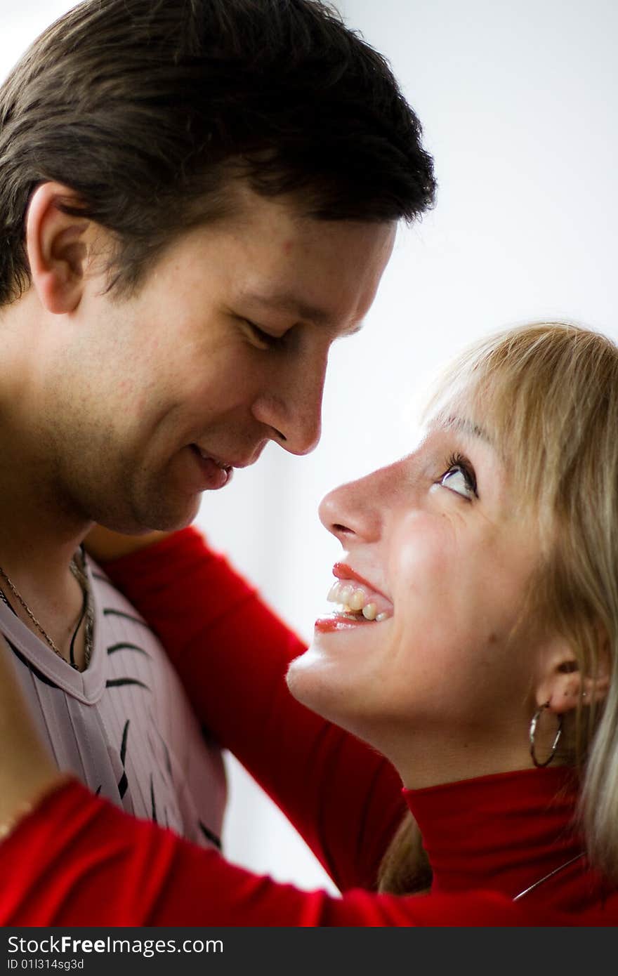 Happy young couple is happy. The girl and the young man are smiling. Happy young couple is happy. The girl and the young man are smiling.