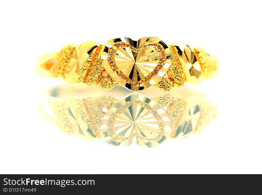 Close up of a golden ring isolated on white background.