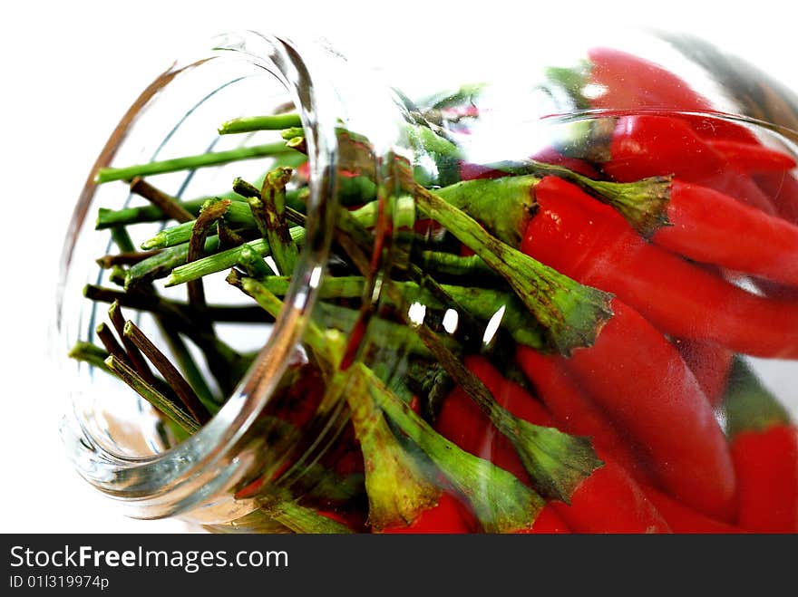 Close up capture red spicy chili on white background. Close up capture red spicy chili on white background