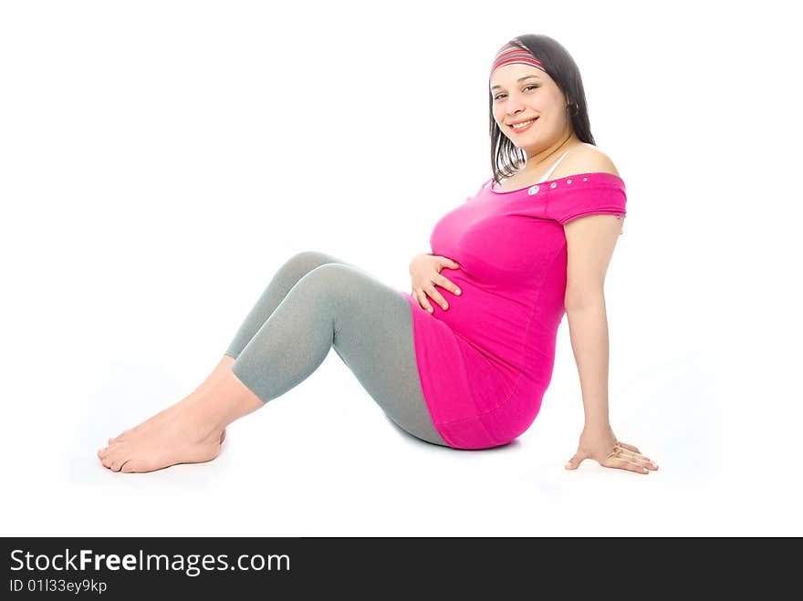 Portrait of a happy beautiful pregnant woman sitting on the floor. Portrait of a happy beautiful pregnant woman sitting on the floor