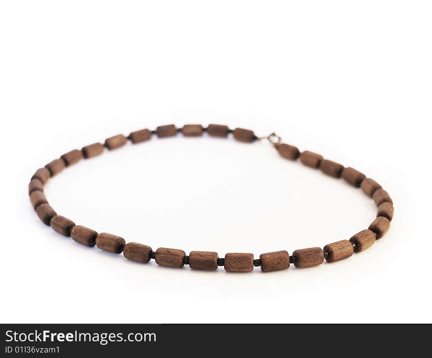 Simple wooden necklace, white background, brown beads