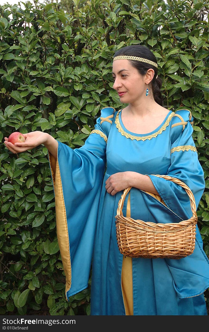 Medieval lady offering red apples