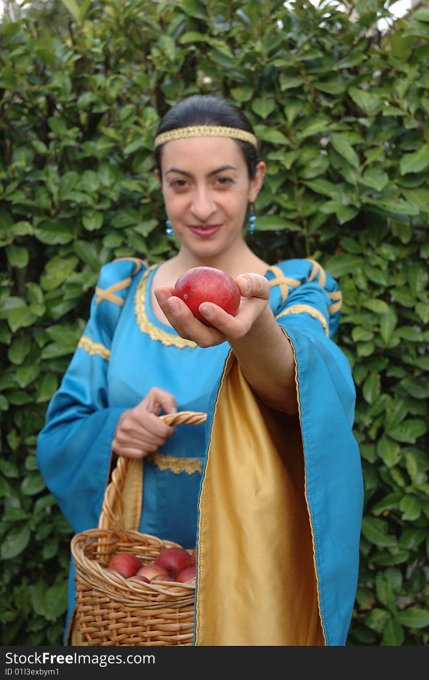 Medieval lady offering red apples