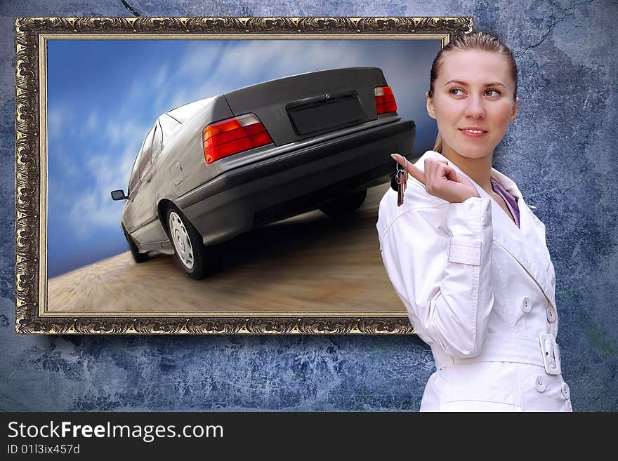 Beautiful women with keys of car on the grunge background