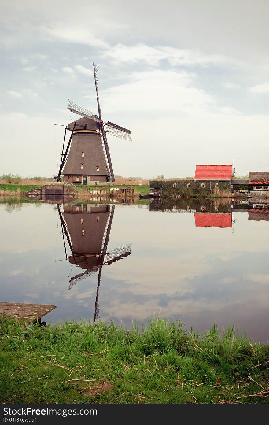 Taken in kinderdijk, Rotterdam, Holland. A windmill and reflection on water.