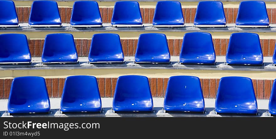 Many blue stadium seats