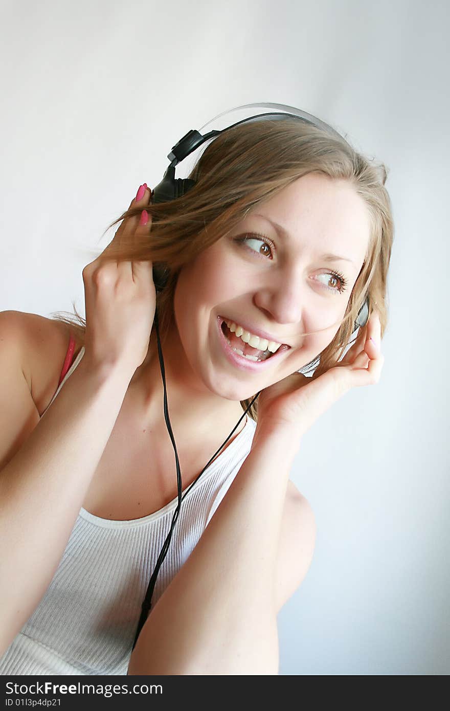 Woman listening music and dances