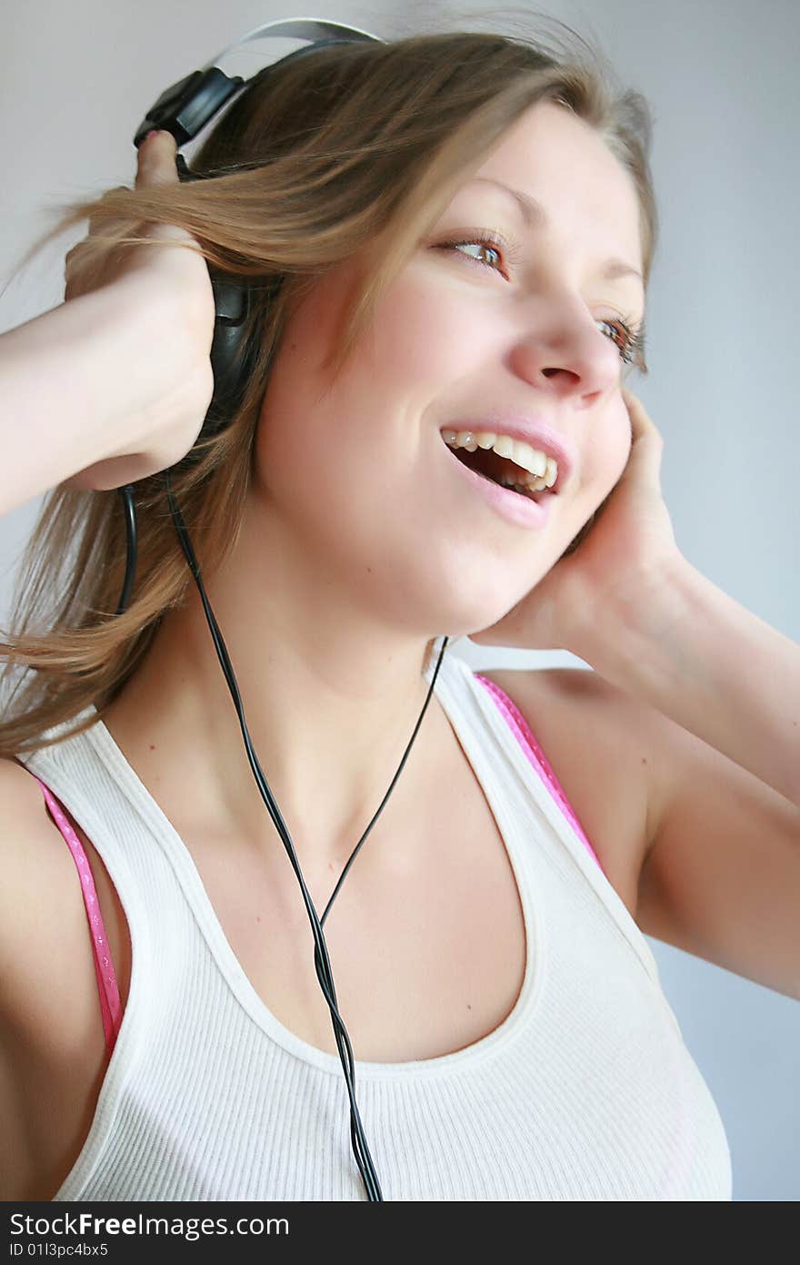 Woman listening music and dances