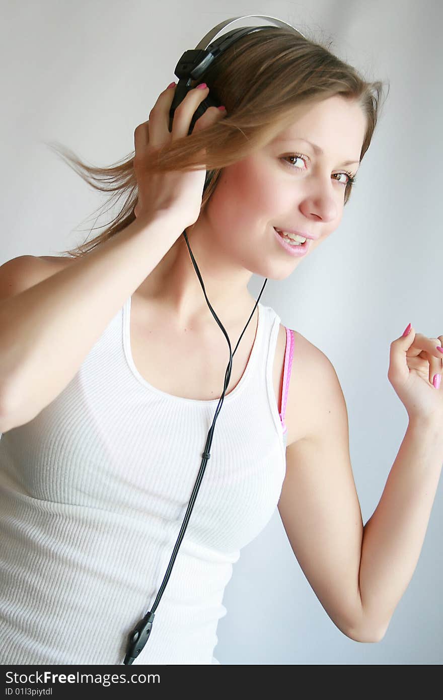 Woman listening music and dances