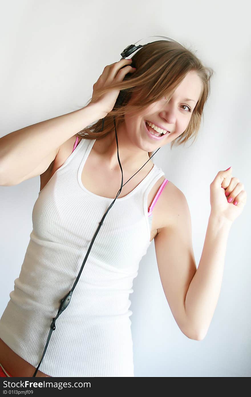 Woman listening music and dances