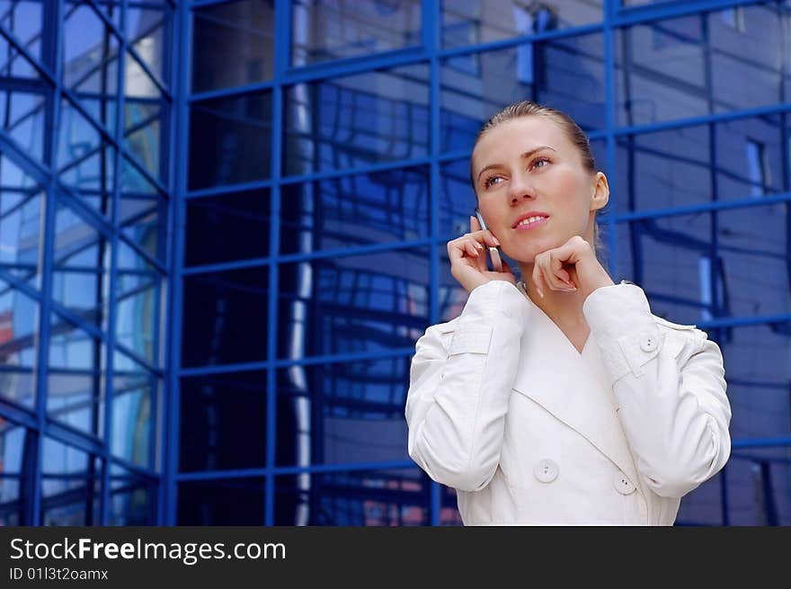 Business women in white on business architecture background