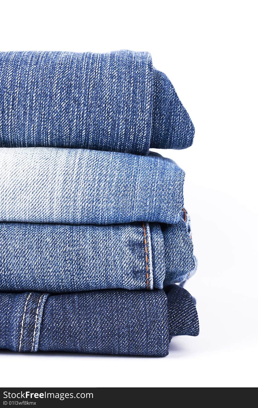 Stack of Blue Jeans isolated over white