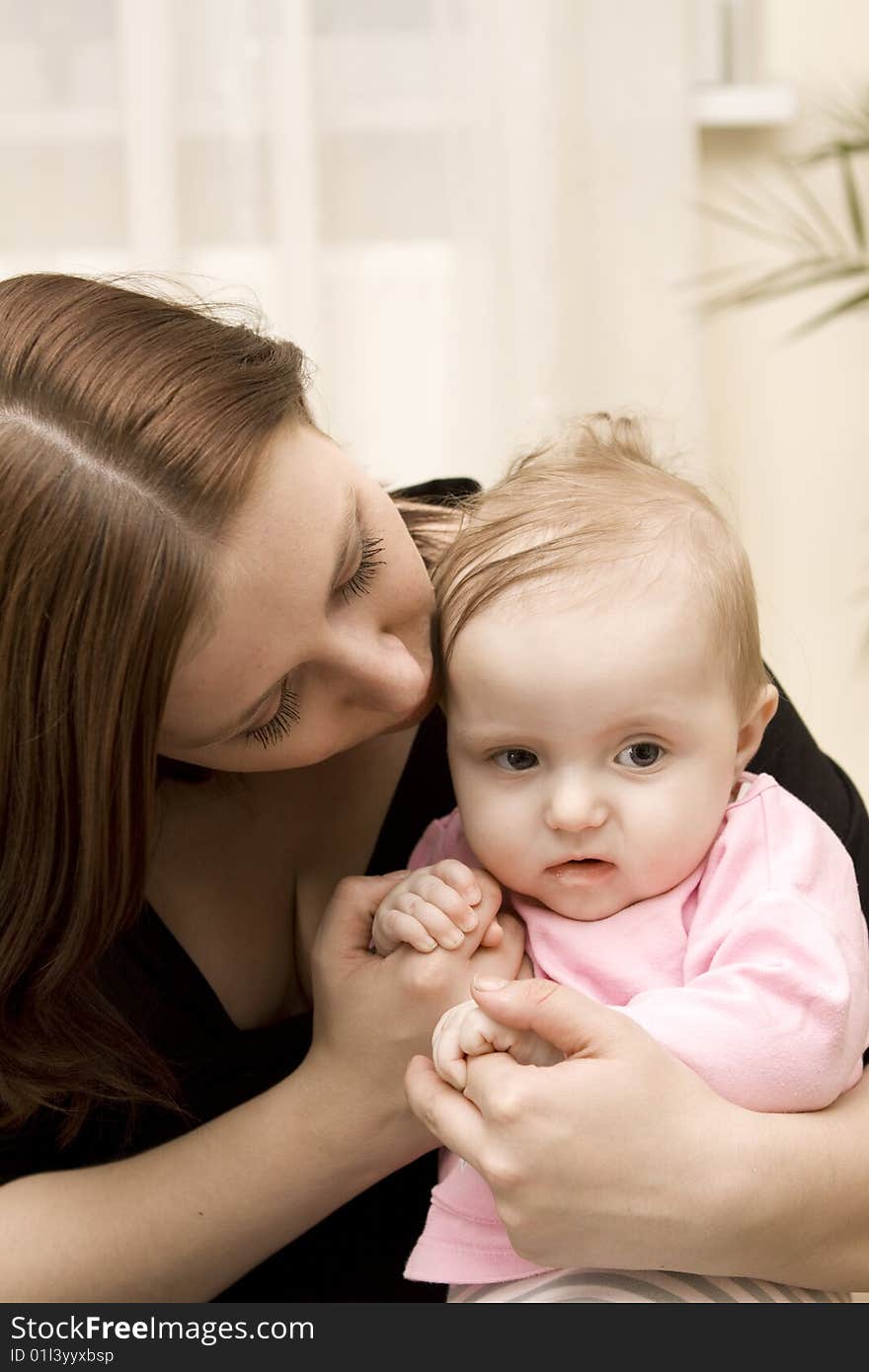 Mother And Baby Playing At Home