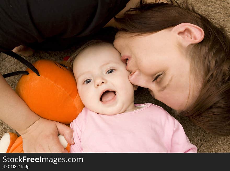 Mother and baby playing in home