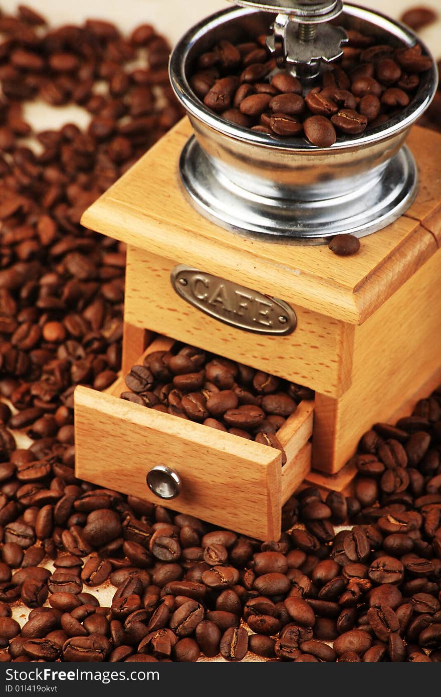 Coffee background: Close-up of a beans cup, mill. Coffee background: Close-up of a beans cup, mill