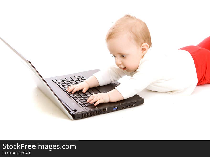 Baby with laptop on white