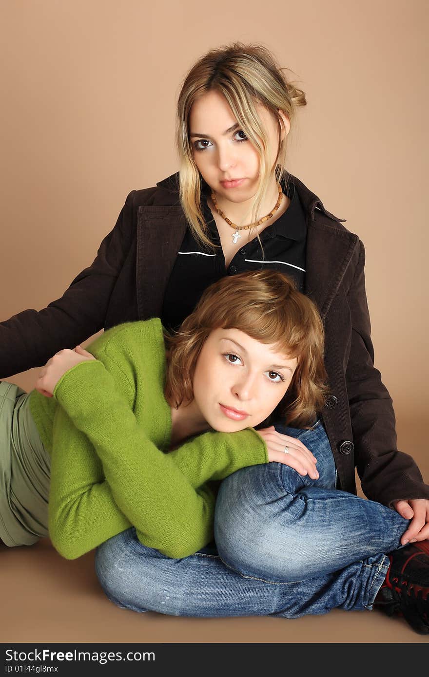 Shot of two beautiful girls. Theme: relations fashion, beauty. Shot of two beautiful girls. Theme: relations fashion, beauty.