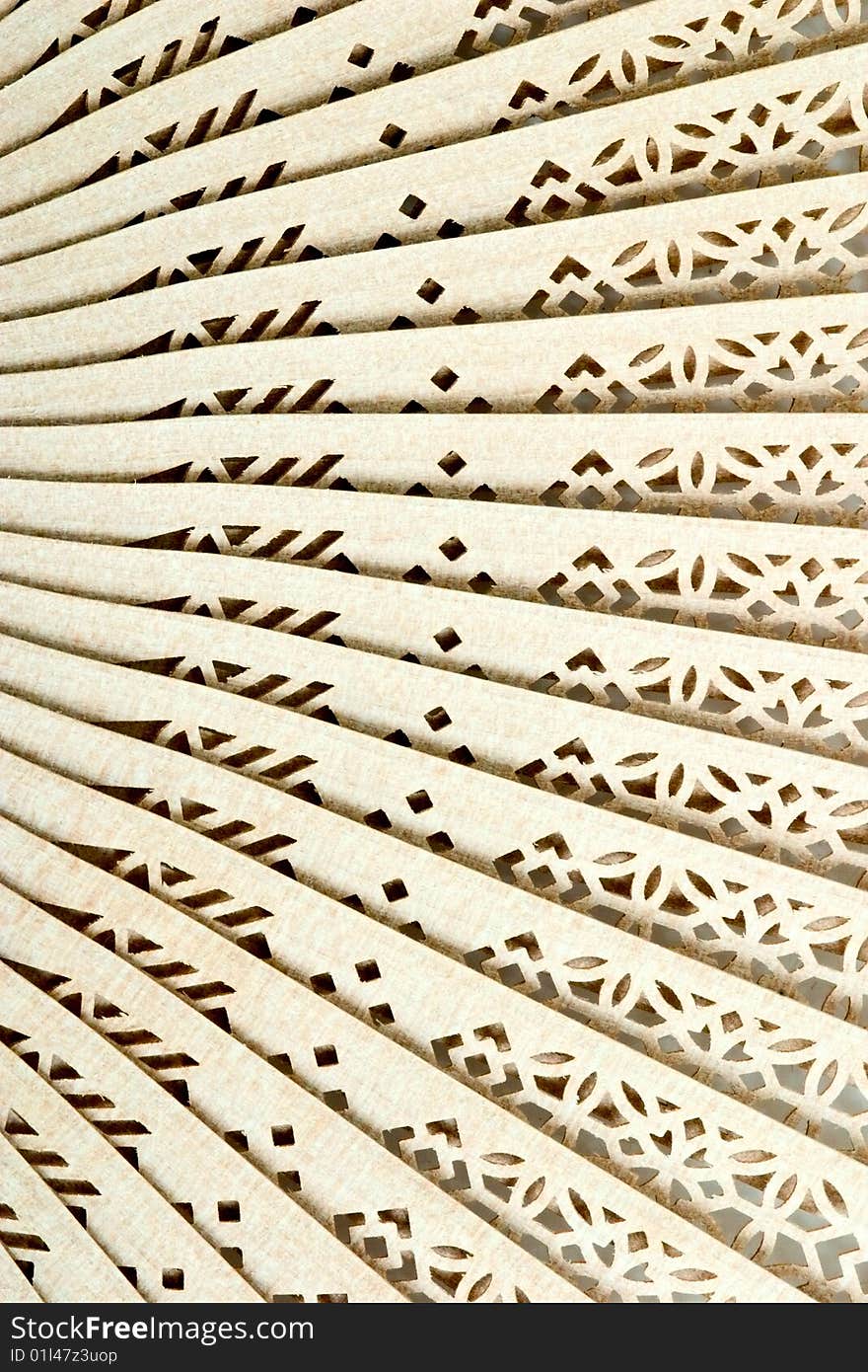 Decorative wooden Japanese fan with ornament