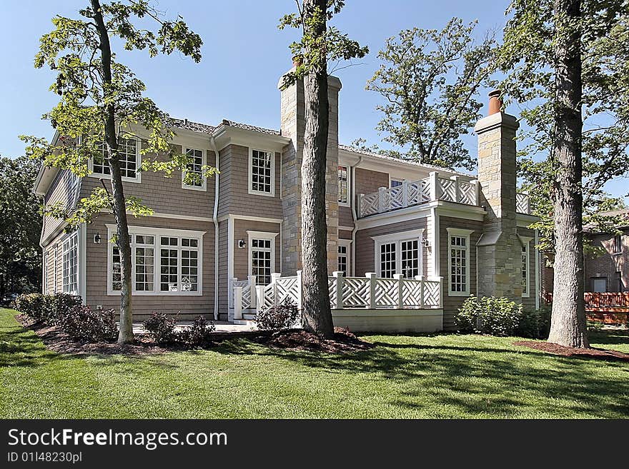 Rear view of new construction shingled home. Rear view of new construction shingled home